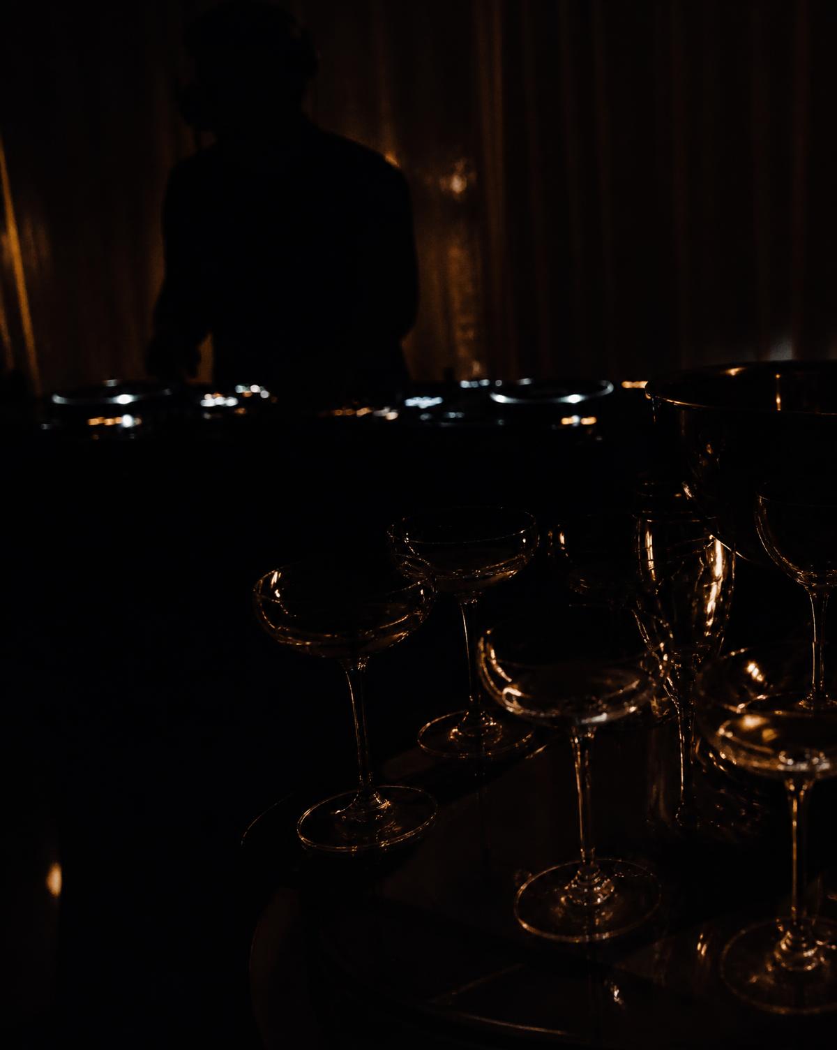 Champagne coupes in low golden light